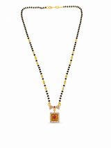 Elegant Black Bead Mangalsutra with Sparkling CZ Bow and Ruby Pendant