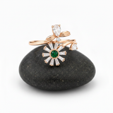 NXGOLD Luxury 360° Rotating Daisy Ring with Emerald Green Stone