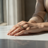 NXGOLD Luxury 360° Rotating Daisy Ring with Emerald Green Stone