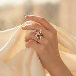 NXGOLD Luxury 360° Rotating Daisy Ring with Emerald Green Stone