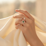 NXGOLD Luxury 360° Rotating Daisy Ring with Emerald Green Stone