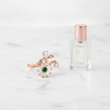 NXGOLD Luxury 360° Rotating Daisy Ring with Emerald Green Stone