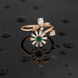 NXGOLD Luxury 360° Rotating Daisy Ring with Emerald Green Stone