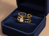 Luxury Triple Band Gold Ring with Brilliant Solitaire Stone