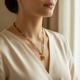 Elegant Black Bead Mangalsutra with Sparkling CZ Bow and Ruby Pendant