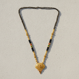 Royal Ethnic Black Bead Mangalsutra with Antique Oval Floral Pendant