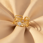Luxury Triple Band Gold Ring with Brilliant Solitaire Stone