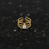 Luxury Triple Band Gold Ring with Brilliant Solitaire Stone