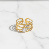 Luxury Triple Band Gold Ring with Brilliant Solitaire Stone