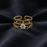 Luxury Triple Band Gold Ring with Brilliant Solitaire Stone